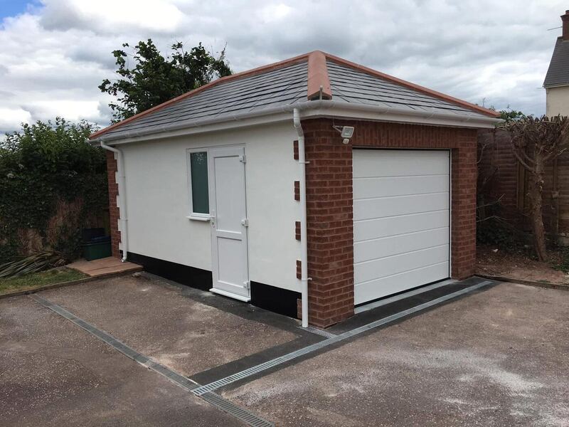 Newly built detached garage with brick detailing